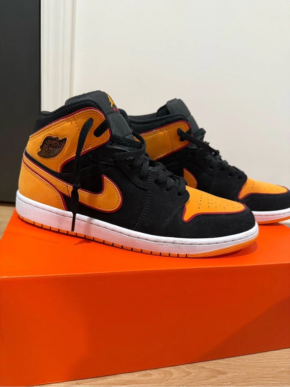 Air Jordan 1 Mid SE Black & Orange Sneakers